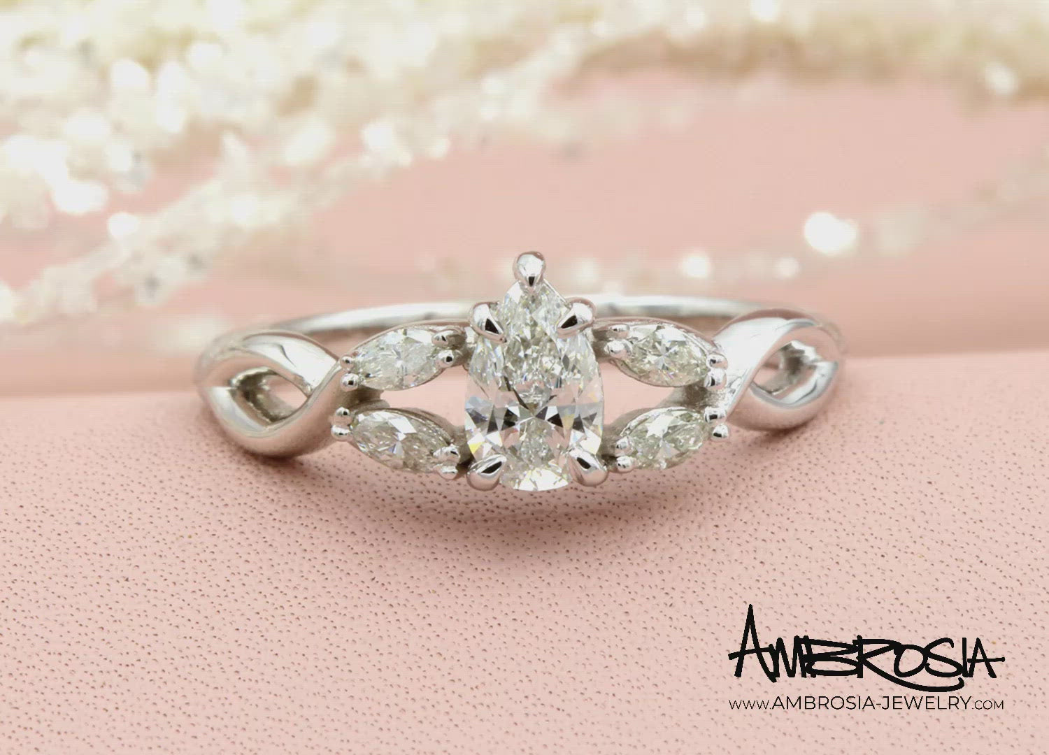 Pear Diamond and Marquise Twist Engagement Ring