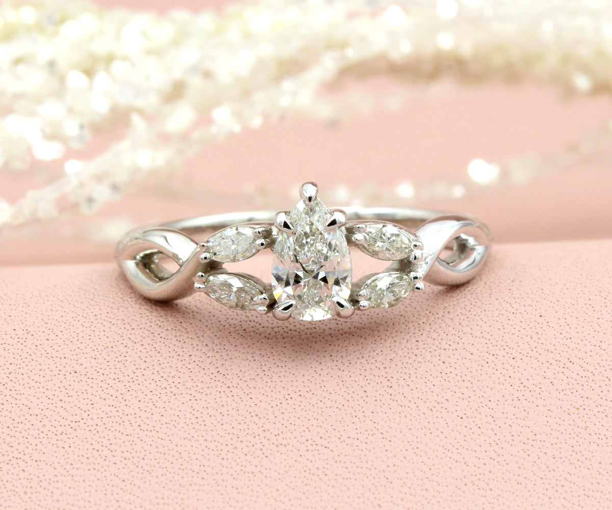Pear Diamond and Marquise Twist Engagement Ring