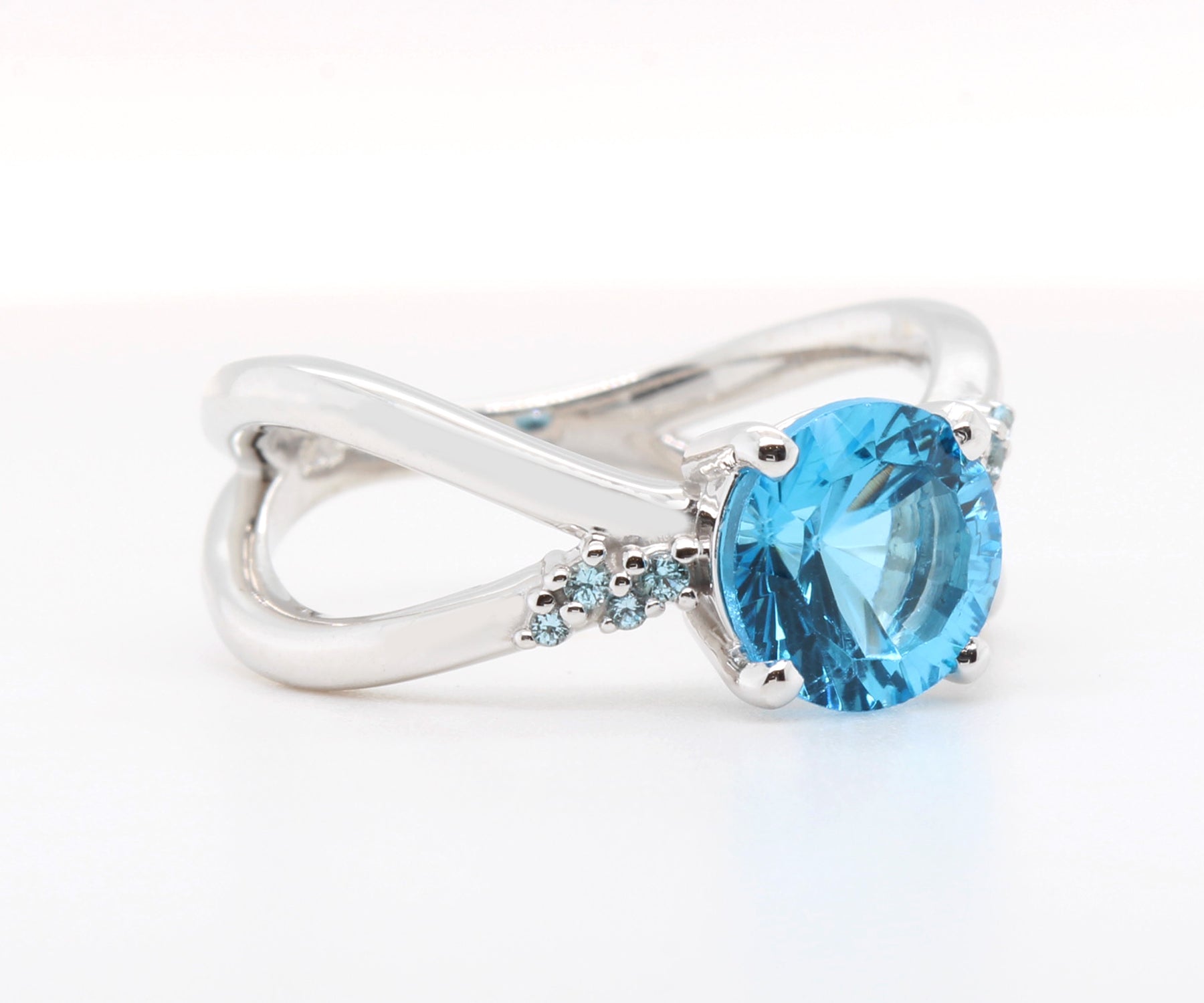 Criss Cross Starburst Blue Topaz Ring