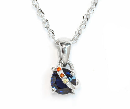 Ambrosia custom designed blue sapphire garnet swirl white gold pendant