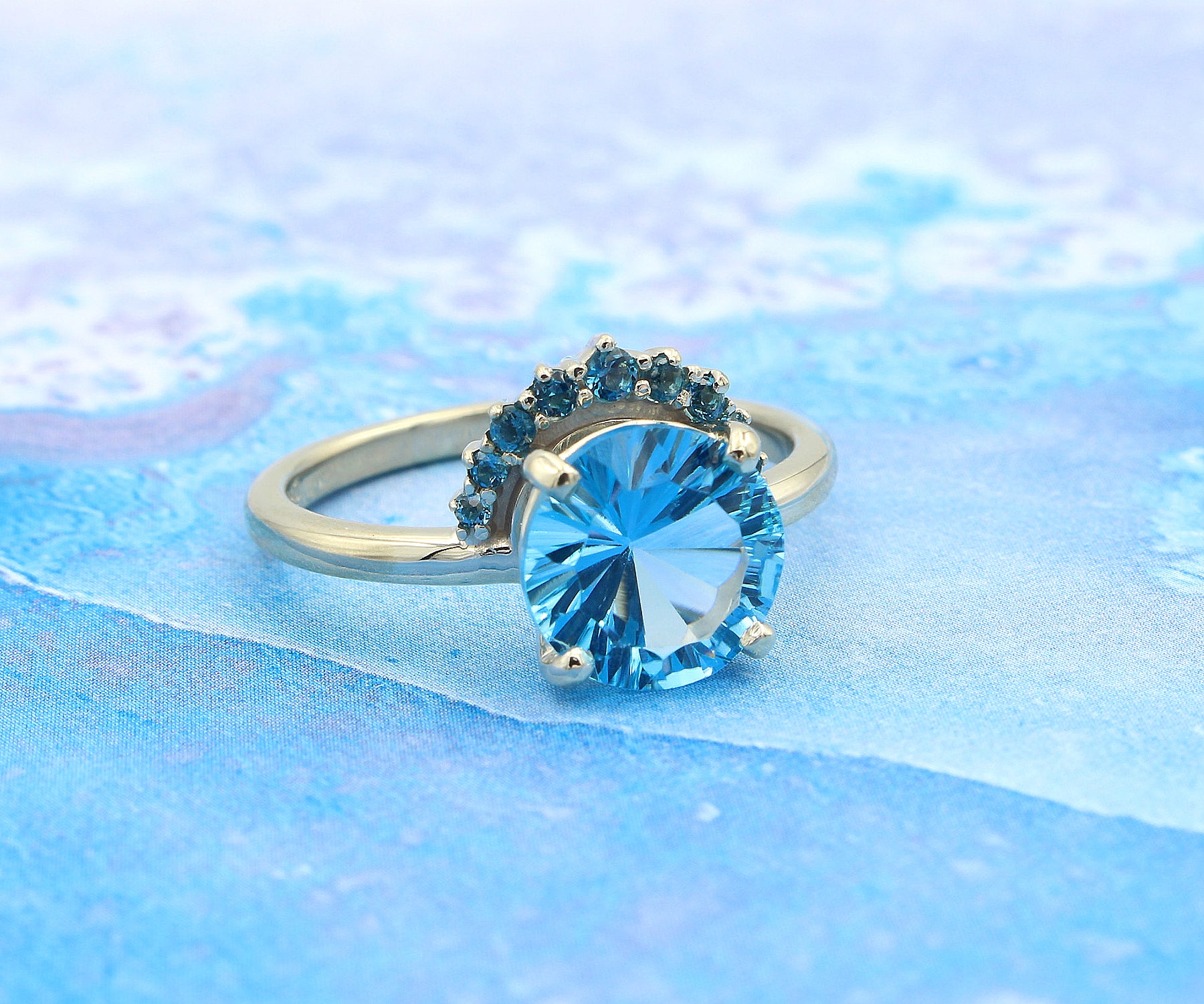 Half Halo Starburst Blue Topaz Ring