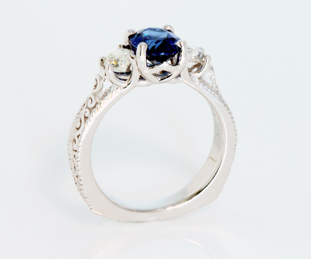 Anillo de compromiso con diamantes y zafiro azul vintage en forma de espiral