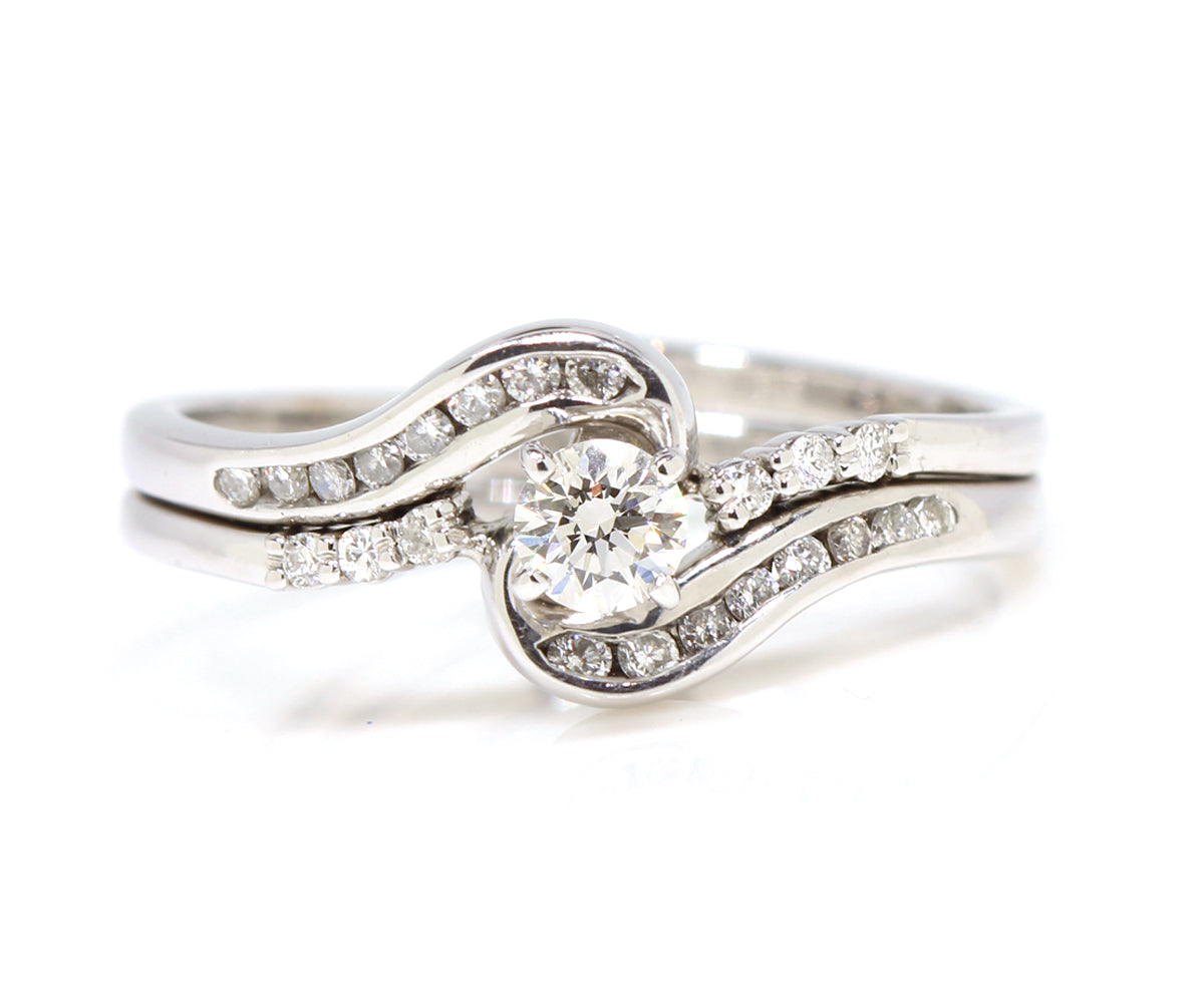 Swirl interlocking diamond channel wedding ring set white gold