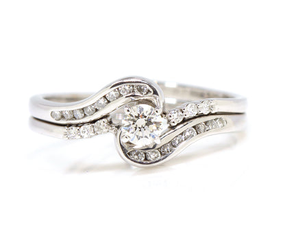 Swirl interlocking diamond channel wedding ring set white gold