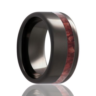 Beveled edge Black Diamond Ceramic ring all high polish with an offset coral inlay